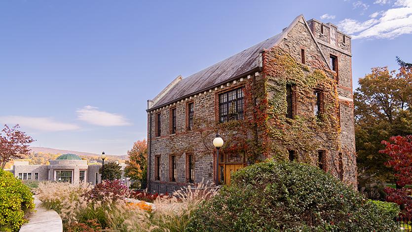 Image of Greystone with Student Center Rotunda in background.